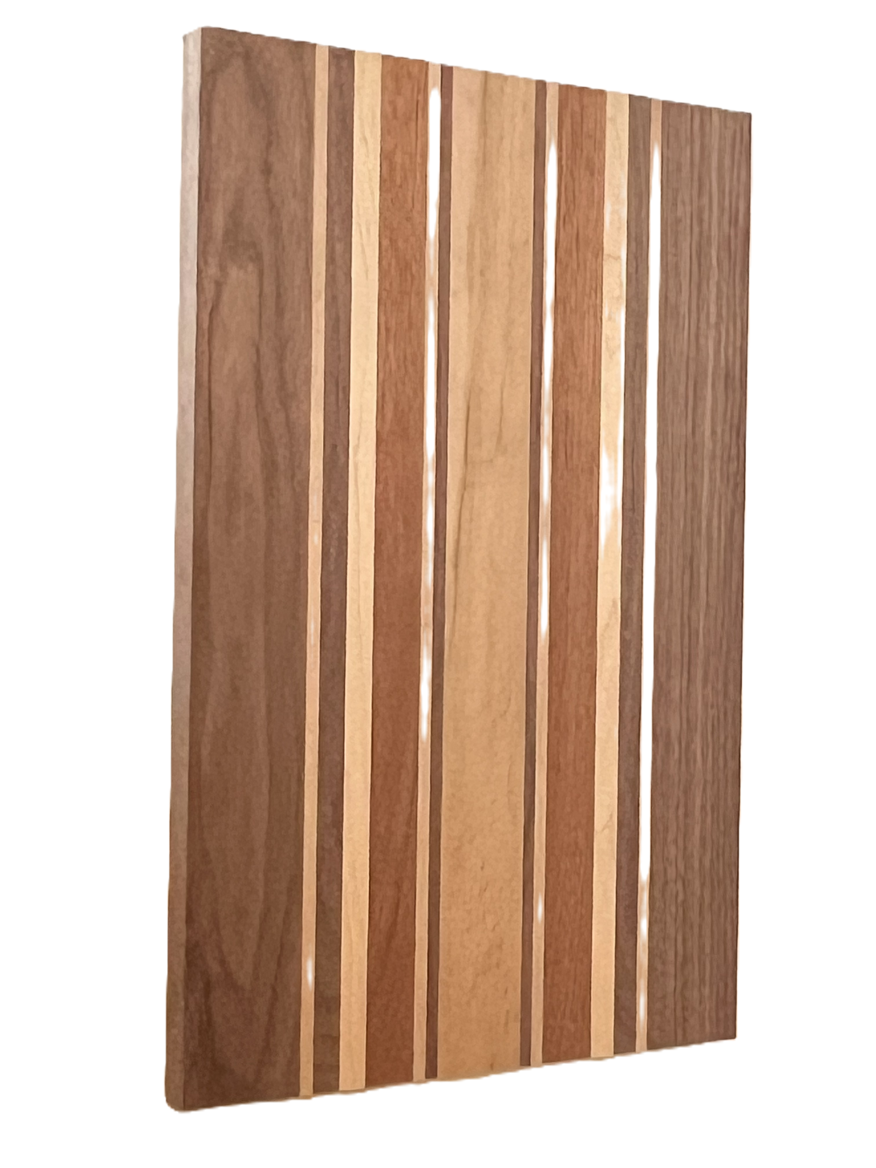 A rectangular cutting board comprised of walnut, maple, and cherry.  The size is approximately 3/4" x 12" x 18".  Custom sizes are available. 